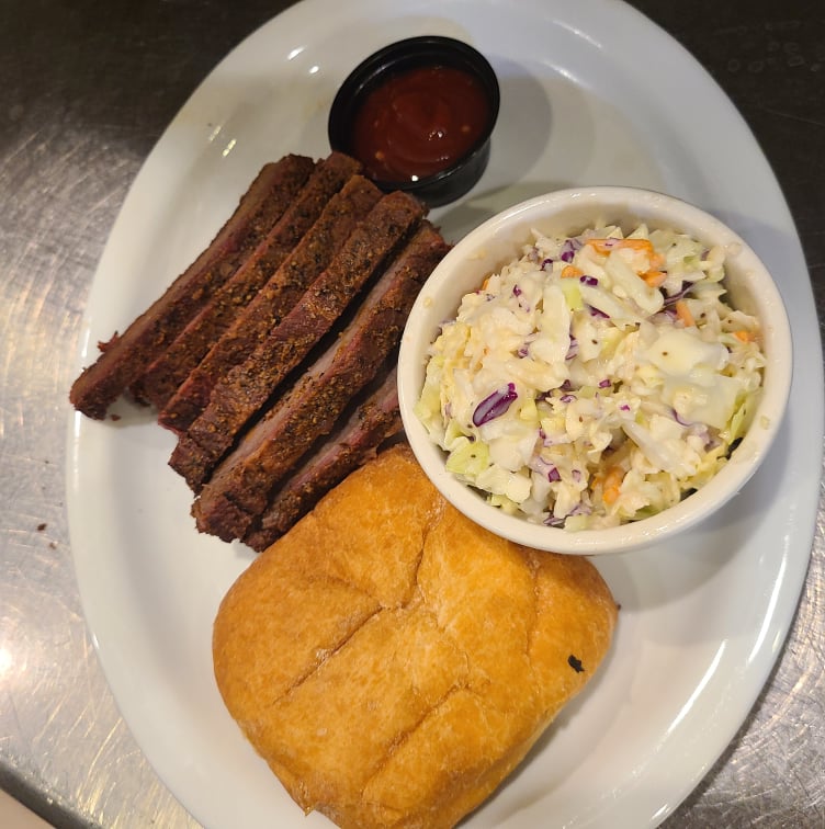 A plate of Buster's food, meat and bread