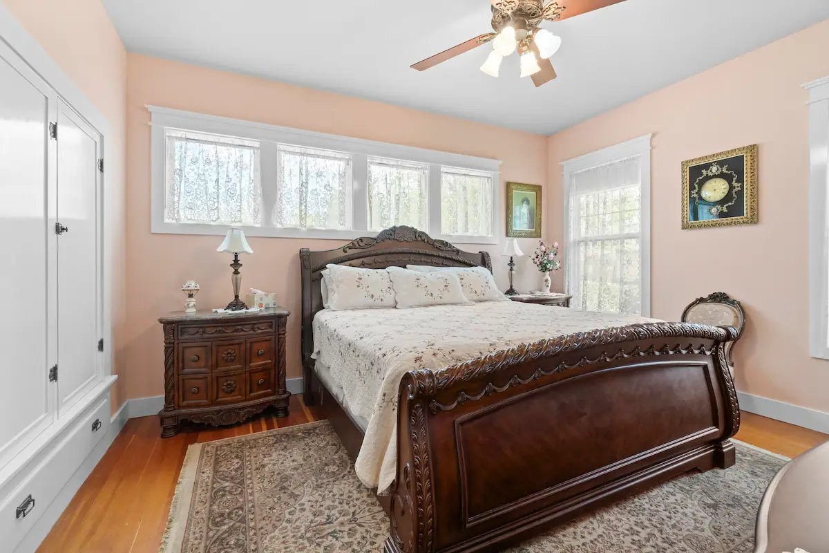 A bedroom with sort of Peach colored walls