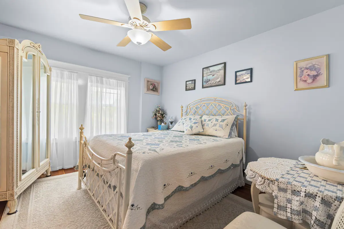 A picture of the bedroom with blue walls